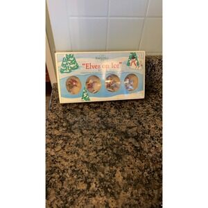 Vintage Department 56 North Pole Series "Elves on Ice" figurines. Set of 4